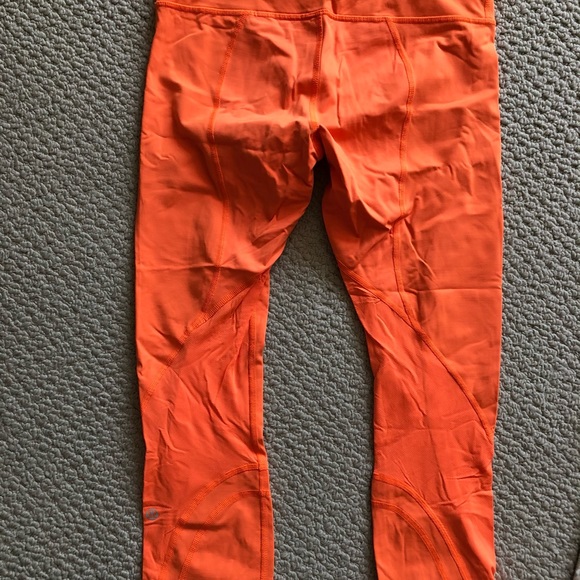 Lululemon neon orange 7/8 leggings. - Picture 2 of 3
